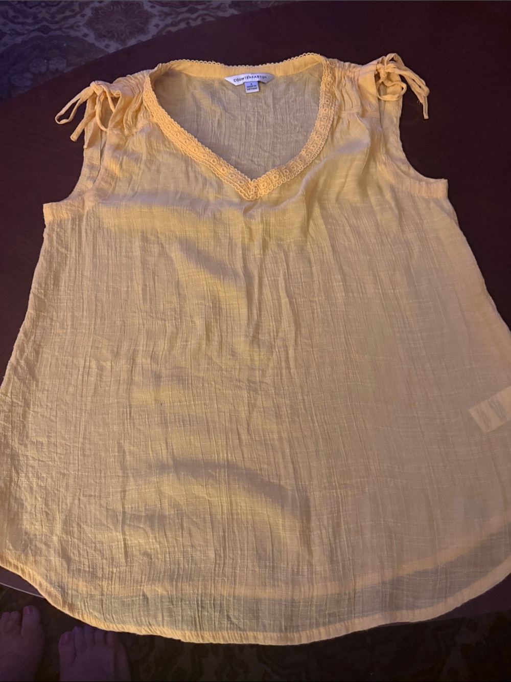 Counterparts tie shoulder yellow gauze tunic.